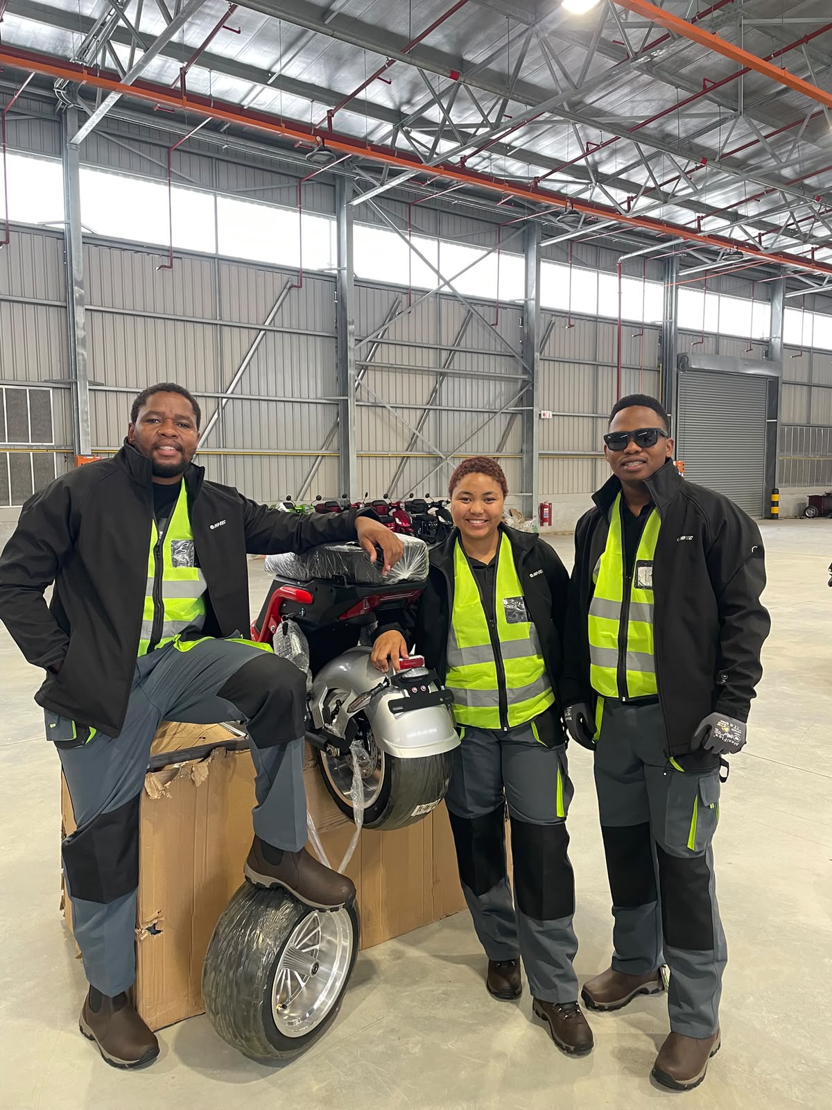 Assembly team with a chopper build in the warehouse