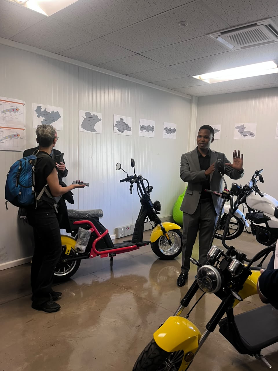 Showroom walkthrough of electric scooters and choppers